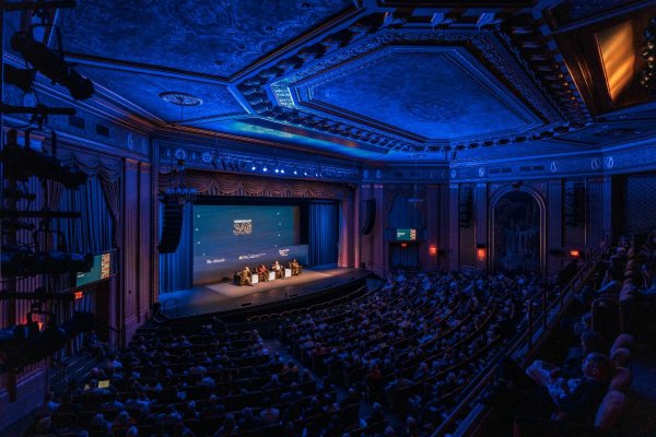 Wide shot of the Paramount Theater bathed in blue light