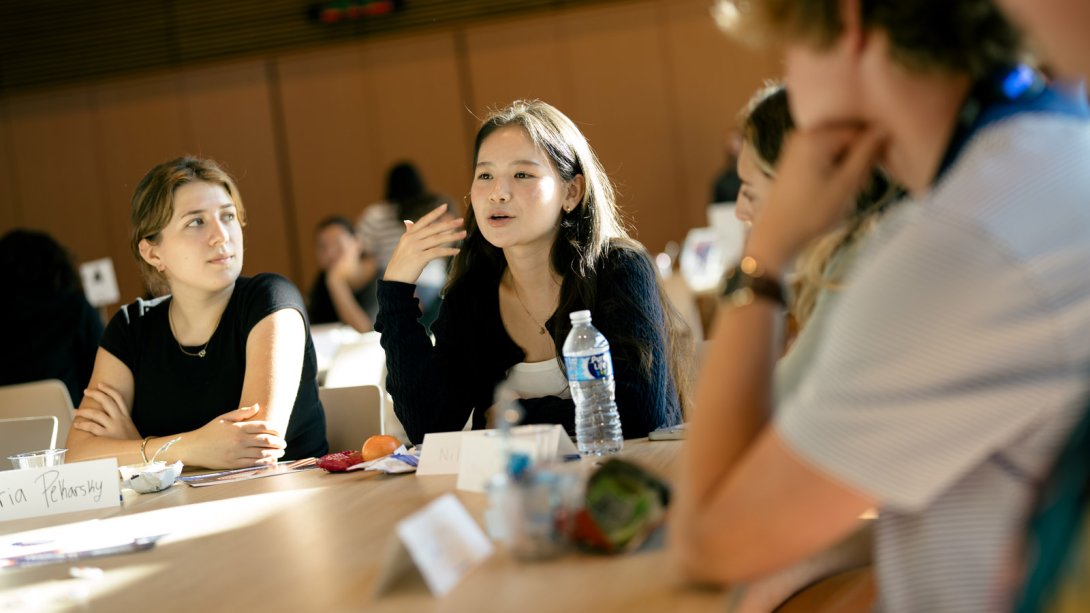 Students discussing important topics at their tables