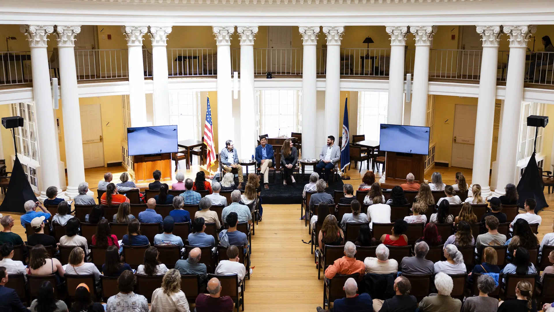 Many attendees seated and listening to a panel of speakers at a Karsh event in the UVA Rotunda
